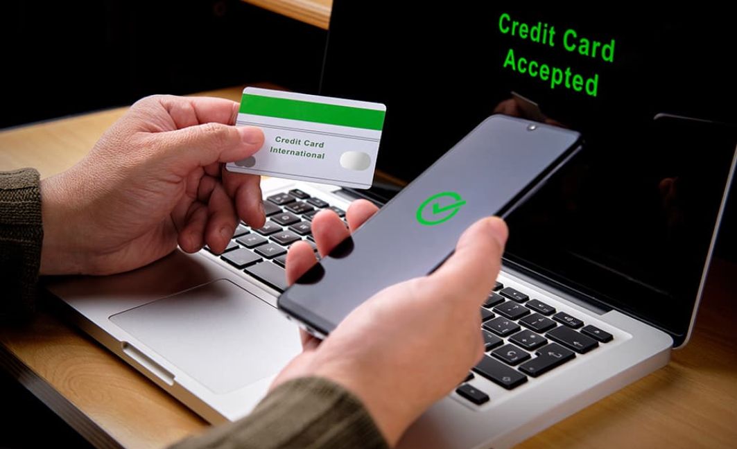 Best way to Accept Credit Cards man on mobile and laptop device
